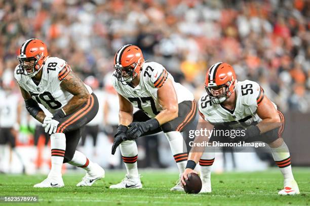 Jack Conklin, Wyatt Teller and Ethan Pocic of the Cleveland Browns wait for the snap call during the first half of a preseason game against the...