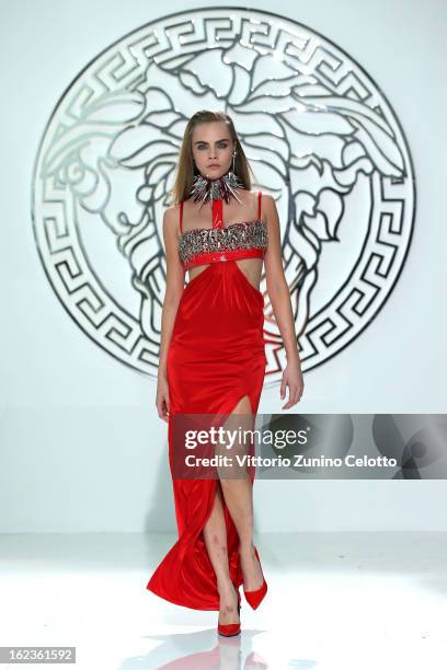 Cara Delevingne walks the runway at the Versace fashion show during Milan Fashion Week Womenswear Fall/Winter 2013/14 on February 22, 2013 in Milan,...