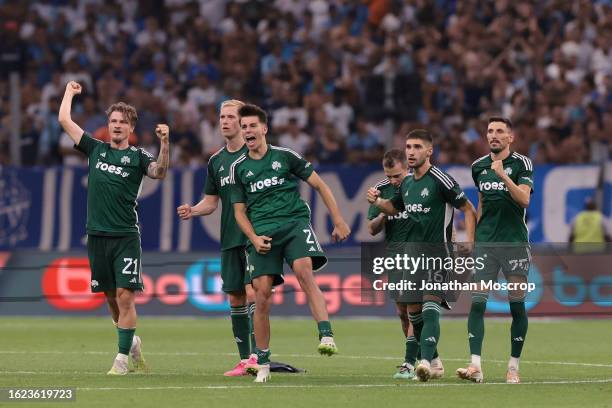 Panathinaikos FC players react during the penalty shoot out of the UEFA Champions League Third Qualifying Round 2nd Leg match between Olympique de...