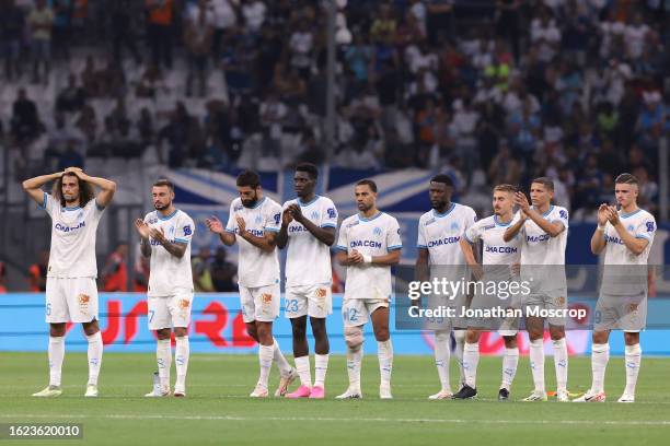 Olympique De Marseille players react during the penalty shoot out of the UEFA Champions League Third Qualifying Round 2nd Leg match between Olympique...