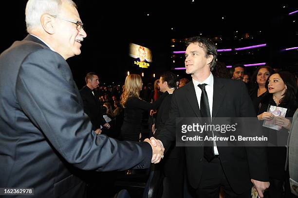 Phil Jackson shakes hands with Luc Robitaille before the memorial service for Los Angeles Lakers Owner Dr. Jerry Buss at Nokia Theatre LA LIVE on...
