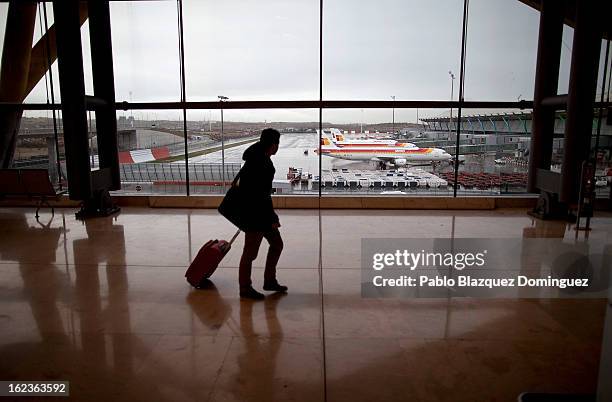 Man walks through Barajas Airport past a fleet of parked Iberia planes on February 22, 2013 in Madrid, Spain. Today is the last of a five day strike...