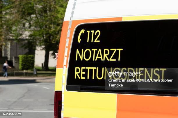 symbolic image, emergency call 112, emergency doctor, rescue service, fire brigade, detail view, lettering on an ambulance, germany - notfallmedizin stock-fotos und bilder
