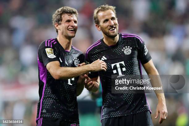 Thomas Mueller and Harry Kane of Bayern Munich celebrate after the team's victory in the Bundesliga match between SV Werder Bremen and FC Bayern...