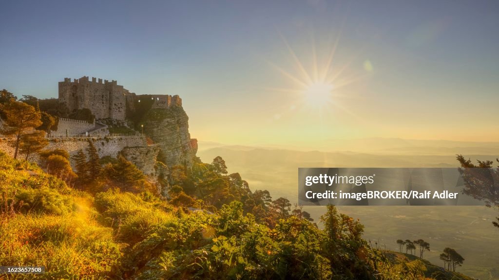 Morning light, backlight, sun as star, fog, Castello di Venere, view of the plain, Erice, Trapani province, mountain, Sicily, Italy
