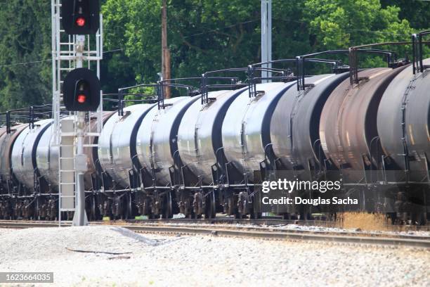 line of train cars with hazardous gases as cargo - volume fluid capacity stock pictures, royalty-free photos & images