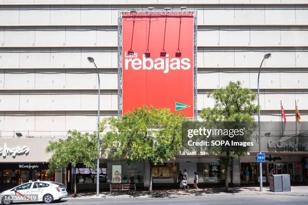 Large Summer sale season billboard hangs outside the Spanish biggest department store El Corte Ingles in Spain.