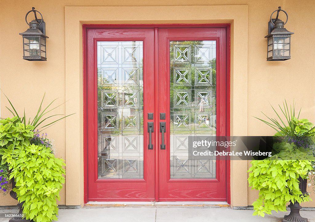 Red double doors in a Aztec styled home