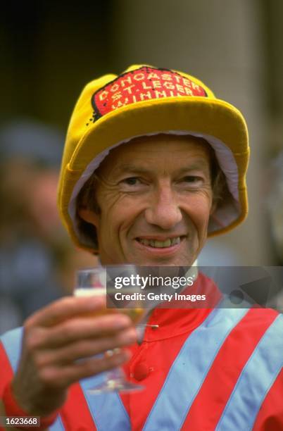 Lester Piggott of Great Britain celebrates after winning the St. Leger on Commanche Run at Doncaster racecourse in Doncaster, England. Piggott broke...