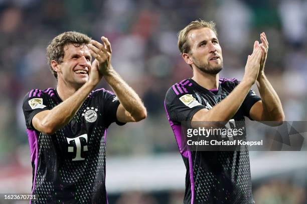 Thomas Mueller and Harry Kane of Bayern Munich applaud the fans after the team's victory in the Bundesliga match between SV Werder Bremen and FC...