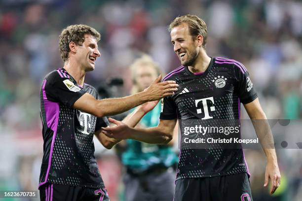 Thomas Mueller and Harry Kane of Bayern Munich celebrate after the team's victory in the Bundesliga match between SV Werder Bremen and FC Bayern...