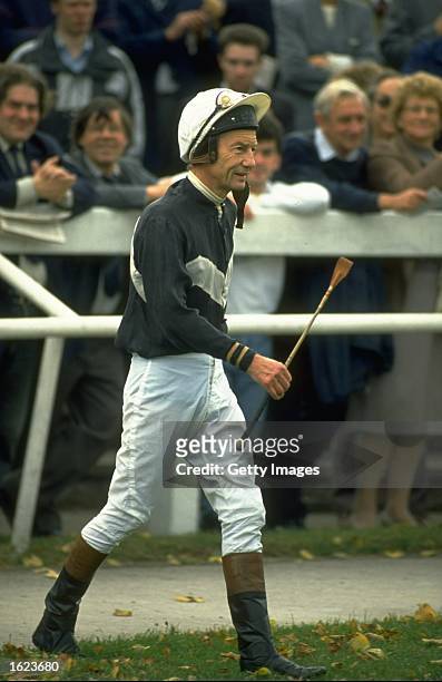 Lester Piggott of Great Britain walks into the saddling enclosure for his first ride in five years at Leicester racecourse in Leicester, England. \...