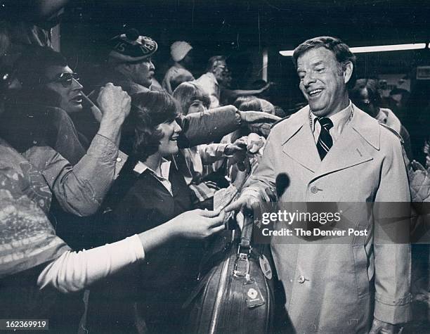 Miller, Red - Groups., Coach; Fans Greet Broncos; Denver Bronco Coach Red Miller is greeted at Stapleton International. Airport after the team...