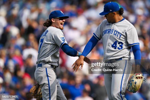 Bobby Witt Jr. #7 and Carlos Hernandez of the Kansas City Royals celebrate the 4-3 win against the Chicago Cubs at Wrigley Field on August 18, 2023...