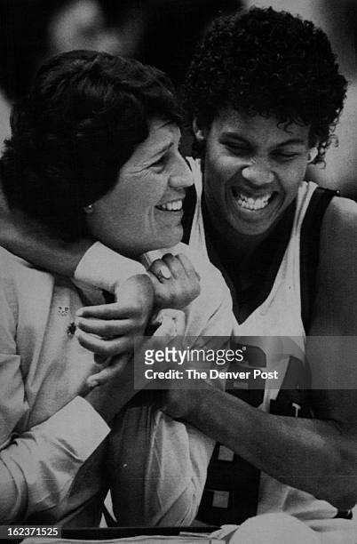 Special transmission to the Denver Post--Cheryl Miller hugs assistant coach Nancy Darsch on the bench after she was removed from ***** game the...