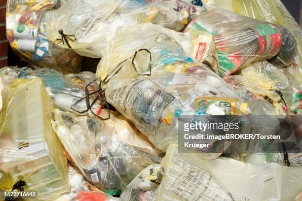 https://media.gettyimages.com/id/1623716642/photo/yellow-bags-for-plastic-waste-waste-separation-germany.jpg?s=612x612&w=gi&k=20&c=U6xIVXJxrSG4ezg-OZ8_asT6bvRe1L02r_AYsM_Fg08=
