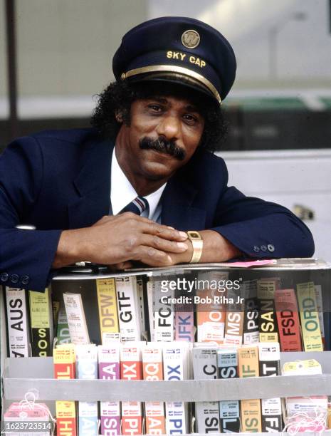Western Airlines Sky Cap Clarence Davis ready with Baggage Tickets at Los Angeles International Airport at start of peak holiday season travel before...
