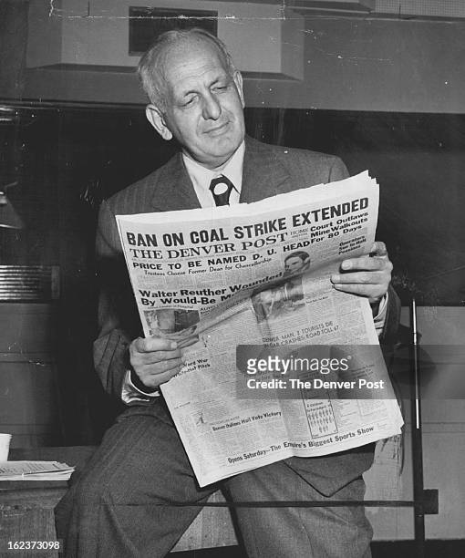 Gabriel Heatter, Kfel-Mutual network news analyst, looks over a copy of The Denver Post, to get background material of his special salute to The Post...