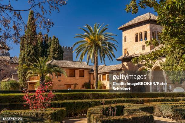 the partal palace and gardens, alhambra world heritage site in granada, andalusia, spain - alhambra granada stock pictures, royalty-free photos & images