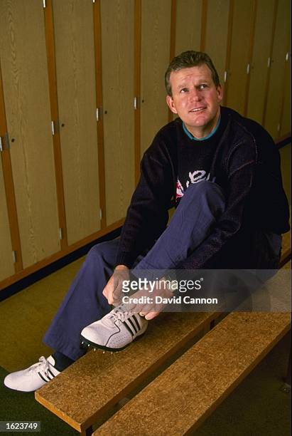Sandy Lyle of Great Britain laces his spikes in a dressing room before a round of golf. \ Mandatory Credit: David Cannon/Allsport