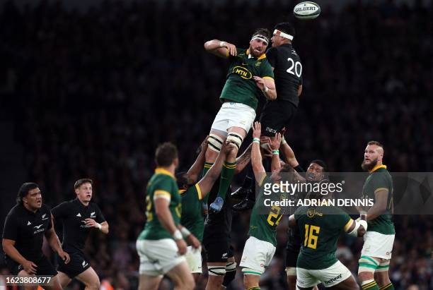 South Africa's Jean Kleyn and New Zealand's Tupou Vaa'i compete in the line out during the pre-World Cup Rugby Union match between New Zealand and...