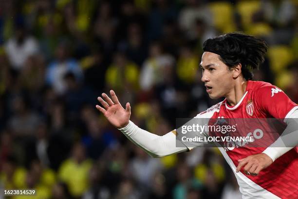 Monaco's Japanese forward Takumi Minamino celebrates after scoring during the French L1 football match between FC Nantes and AS Monaco at the...