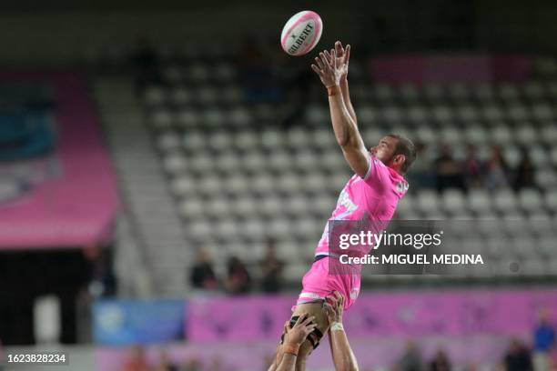 Stade Francais' French flanker Romain Briatte is lifted to catch the ball in a lineout during the French Top14 rugby union match between Stade...