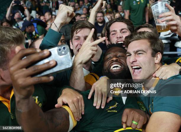 South Africa's flanker Siyamthanda Kolisi celebrates with supporters after the pre-World Cup Rugby Union match between New Zealand and South Africa...