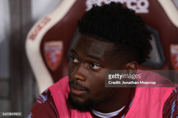 Brian Bayeye of Torino FC looks on from the bench prior to the Coppa Italia Round of 32 match between Torino FC and Feralpisalo at Stadio Olimpico...