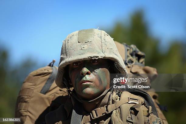 Pfc. Margarita Salinas patrols during Marine Combat Training on February 20, 2013 at Camp Lejeune, North Carolina. Since 1988 all non-infantry...