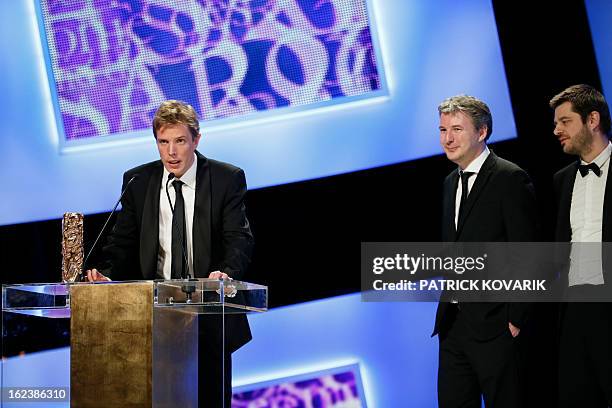 French director Nicolas Guiot speaks beside his trophy after receiving the Best Short Film award for his film "Le cri du homard" during the 38th...