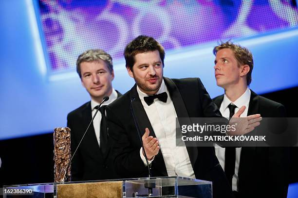 French director Nicolas Guiot listens after receiving the Best Short Film award for his film "Le cri du homard" during the 38th Cesar Awards ceremony...
