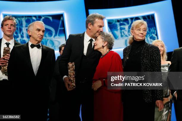 Actor and director Kevin Costner, French actress Emmanuelle Riva and Hungarian-born French producer Margaret Menegoz pose with their trophies beside...