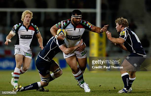 James Johnston of Harlequins is tackled by James Gaskell and Daniel Braid of Sale during the Aviva Premiership match between Sale Sharks and...