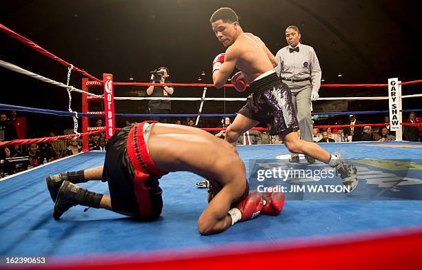 Featherweight Gevonte Davis of Baltimore, MD, knocks out Desi Williams in the first round on the under-card matches at the DC Armory in Washington,...