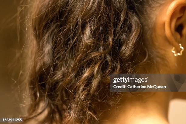 multiracial teen girl wears natural hair in ponytail - straight black hair stock pictures, royalty-free photos & images