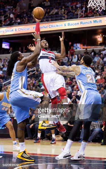 Washington Wizards point guard John Wall shoots over Denver Nuggets ...