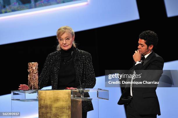 Margaret Menegoz receives the Best Film Cesar for 'Amour' on behalf of Michael Haneke next to Jamel Debbouze during the 37th Cesar Film Awards Cesar...