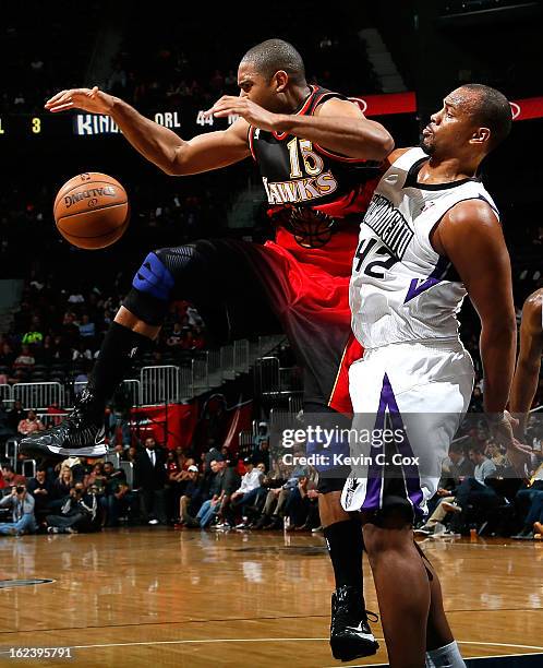 Chuck Hayes of the Sacramento Kings fouls Al Horford of the Atlanta Hawks at Philips Arena on February 22, 2013 in Atlanta, Georgia. NOTE TO USER:...