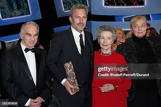 Alain terzian, President of the Cesar Awards Academy, Kevin Costner, holding his Cesar of Honor award, best actress Emmanuelle Riva for "Amour" and...