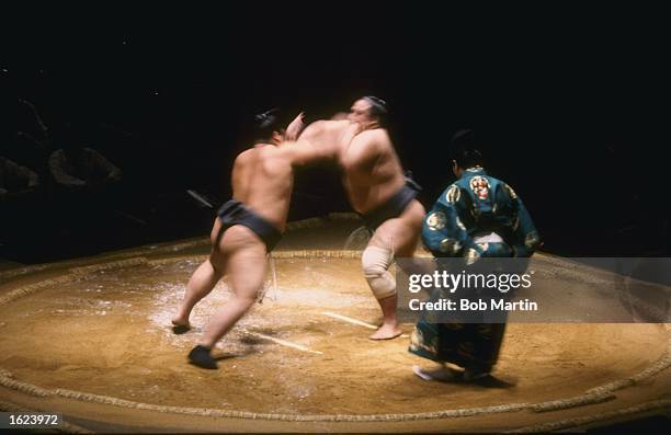 Two competitors during a bout at the Grand Sumo Wrestling Tournament at The Royal Albert Hall in London. \ Mandatory Credit: Bob Martin/Allsport