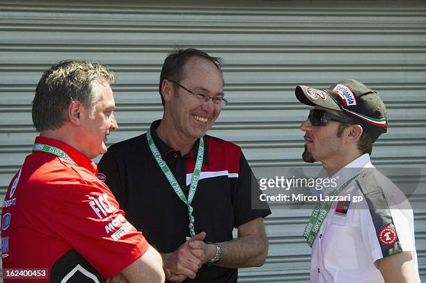 Bernhard Gobmeier of Germany speaks with Max Biaggi of Italy in paddock during the qualifying practice during the round first of 2013 Superbike FIM...