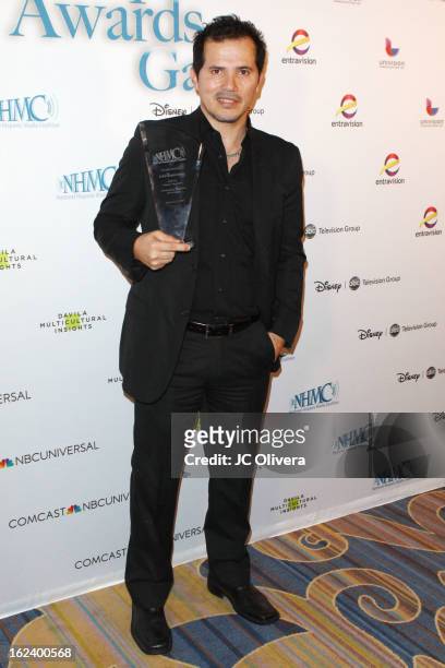 Actor John Leguizamo poses with his Outstanding Theatrical Performance Award during the National Hispanic Media Coalition's 16th Annual Impact Awards...