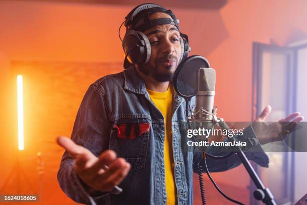 Rapper In Studio Rapping 59 Portrait Of A Rapper Wearing Headphones In A Recording Studio Stock ...