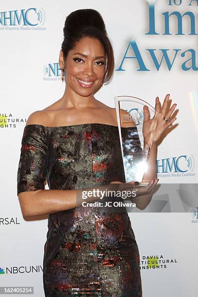 Actress Gina Torres poses with her Outstanding Performance in a Television Series Award during the National Hispanic Media Coalition's 16th Annual...