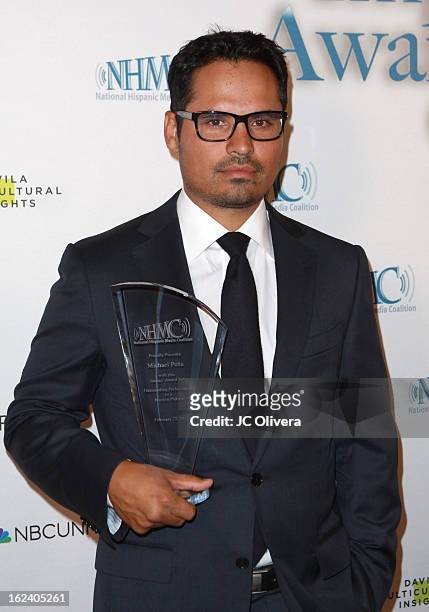 Actor Michael Pena poses with his Outstanding Performance in a Motion Picture Award during the National Hispanic Media Coalition's 16th Annual Impact...