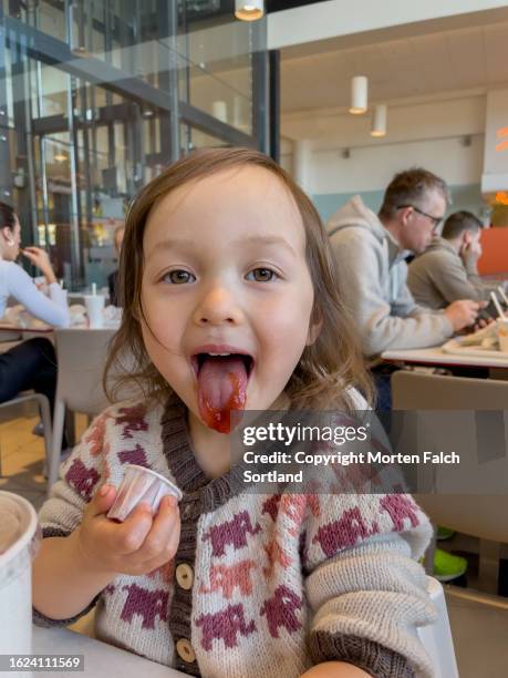 a child eating ketchup - ketchup stock pictures, royalty-free photos & images