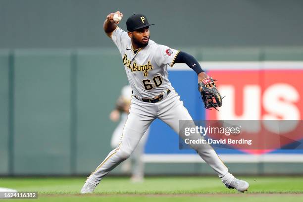 Liover Peguero of the Pittsburgh Pirates throws the ball to first base to get out Royce Lewis of the Minnesota Twins in the second inning at Target...