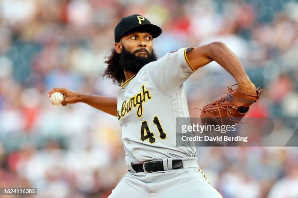 Andre Jackson of the Pittsburgh Pirates delivers a pitch against the Minnesota Twins in the first inning at Target Field on August 18, 2023 in...
