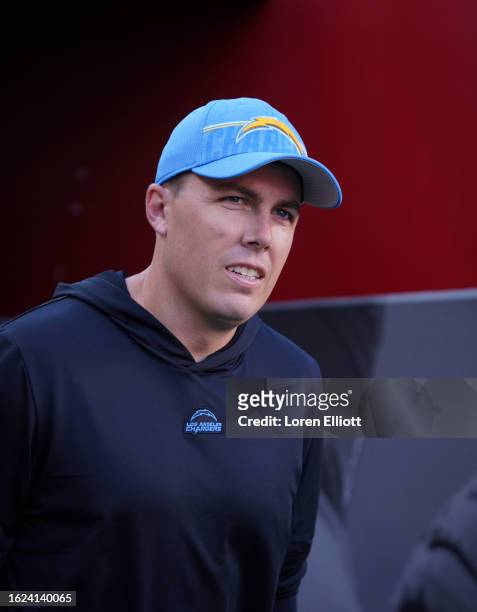 Offensive coordinator Kellen Moore of the Los Angeles Chargers prepares to play the San Francisco 49ers in a preseason game at Levi's Stadium on...